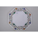 An Indian hexagonal  shaped marble top inlaid with lapiz lazuli, malachite, agate and mother of