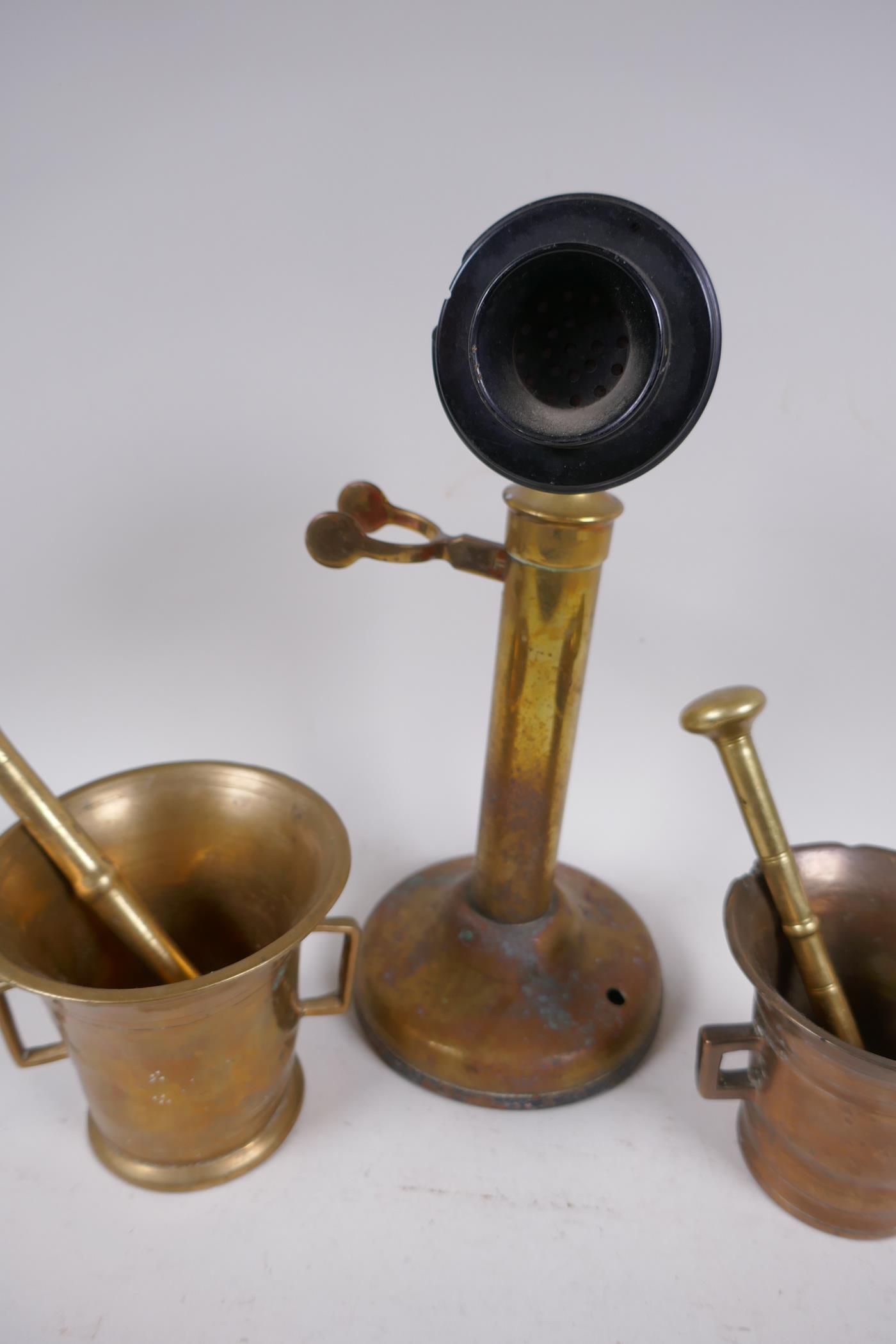 A brass candlestick telephone, AF, 31.5cm high, and two brass mortar and pestles - Image 4 of 4