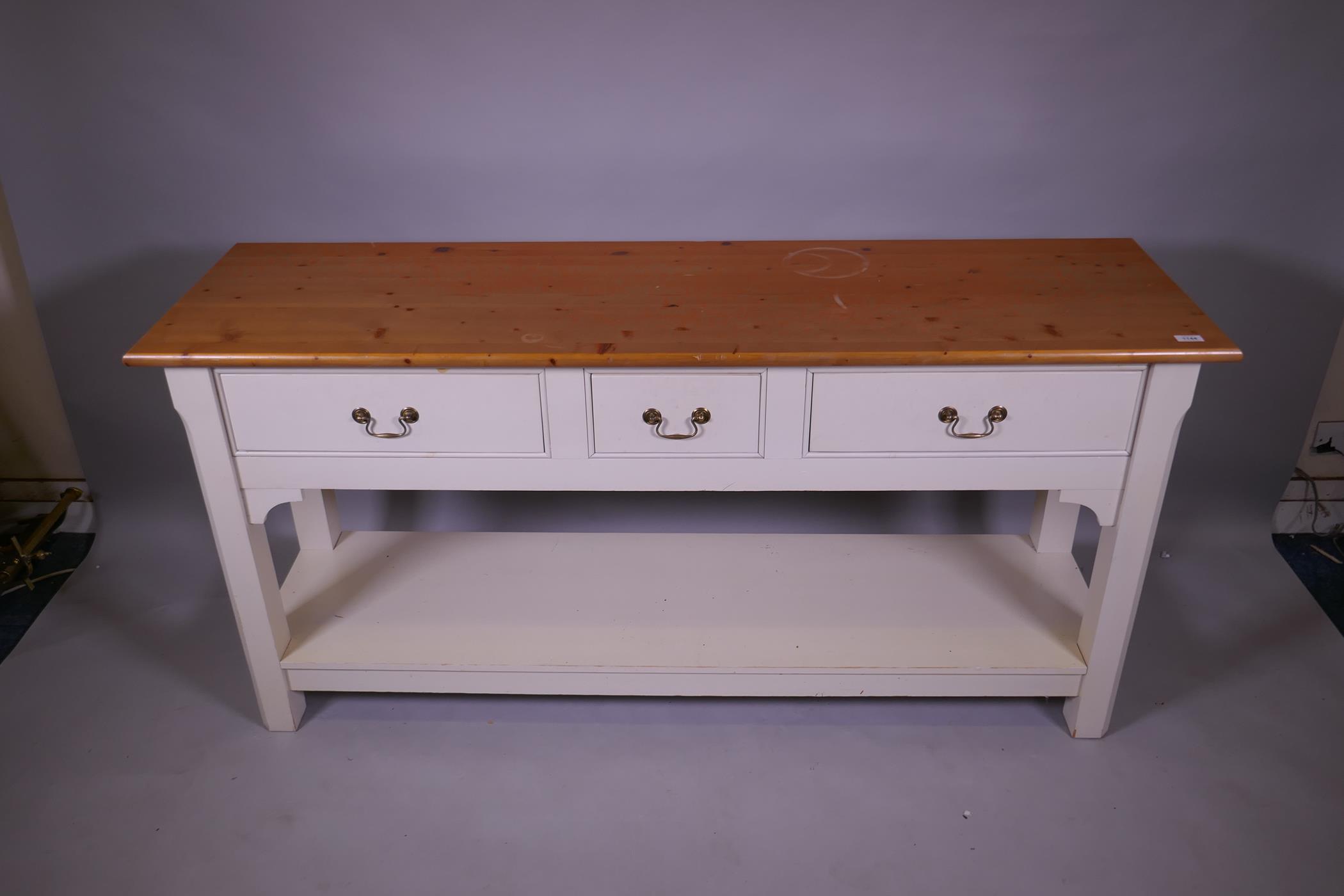 A contemporary pine dresser, the painted base with two drawers and pot board, raised on chamfered - Image 2 of 3