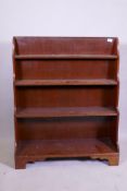A mahogany waterfall open bookcase, raised on bracket supports, 85 x 29 x 104cm