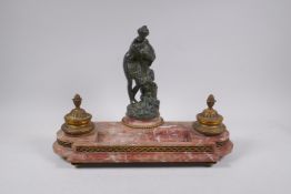 A C19th French rouge marble and ormolu desk set decorated with a bronze figure of Venus, 41cm long x