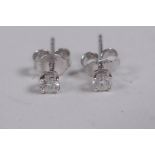 A pair of 18ct white gold stud earrings, approx 30 points