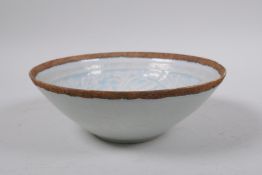 A Chinese Song style celadon glazed porcelain dish with underglaze phoenix decoration, 18cm diameter