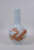 A Chinese Ming style porcelain bottle vase with unglazed dragon decoration, 4 character mark to