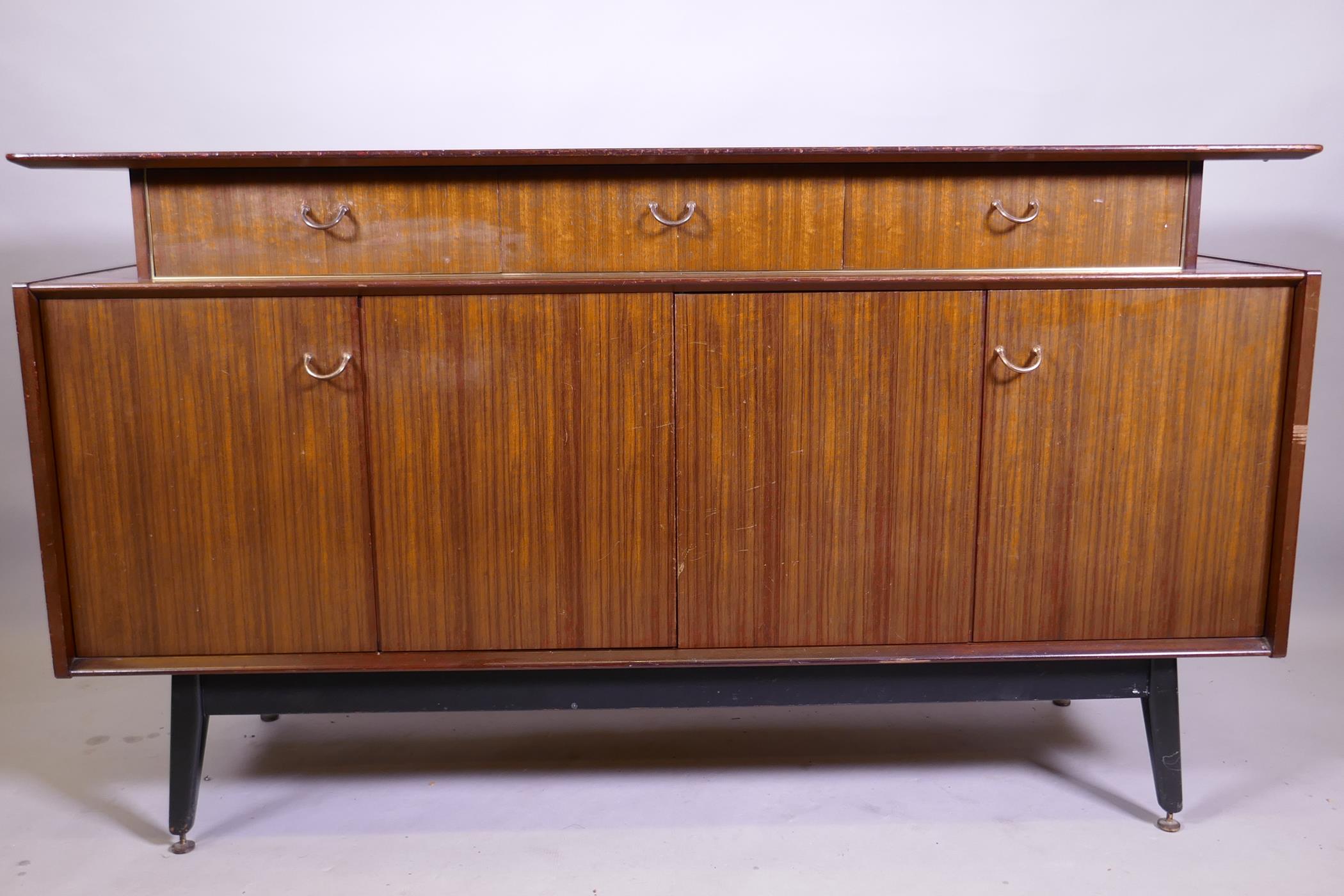 A mid century G-Plan Librenza tola sideboard raised on ebonised supports, 150 x 46 x 86cm - Image 3 of 3