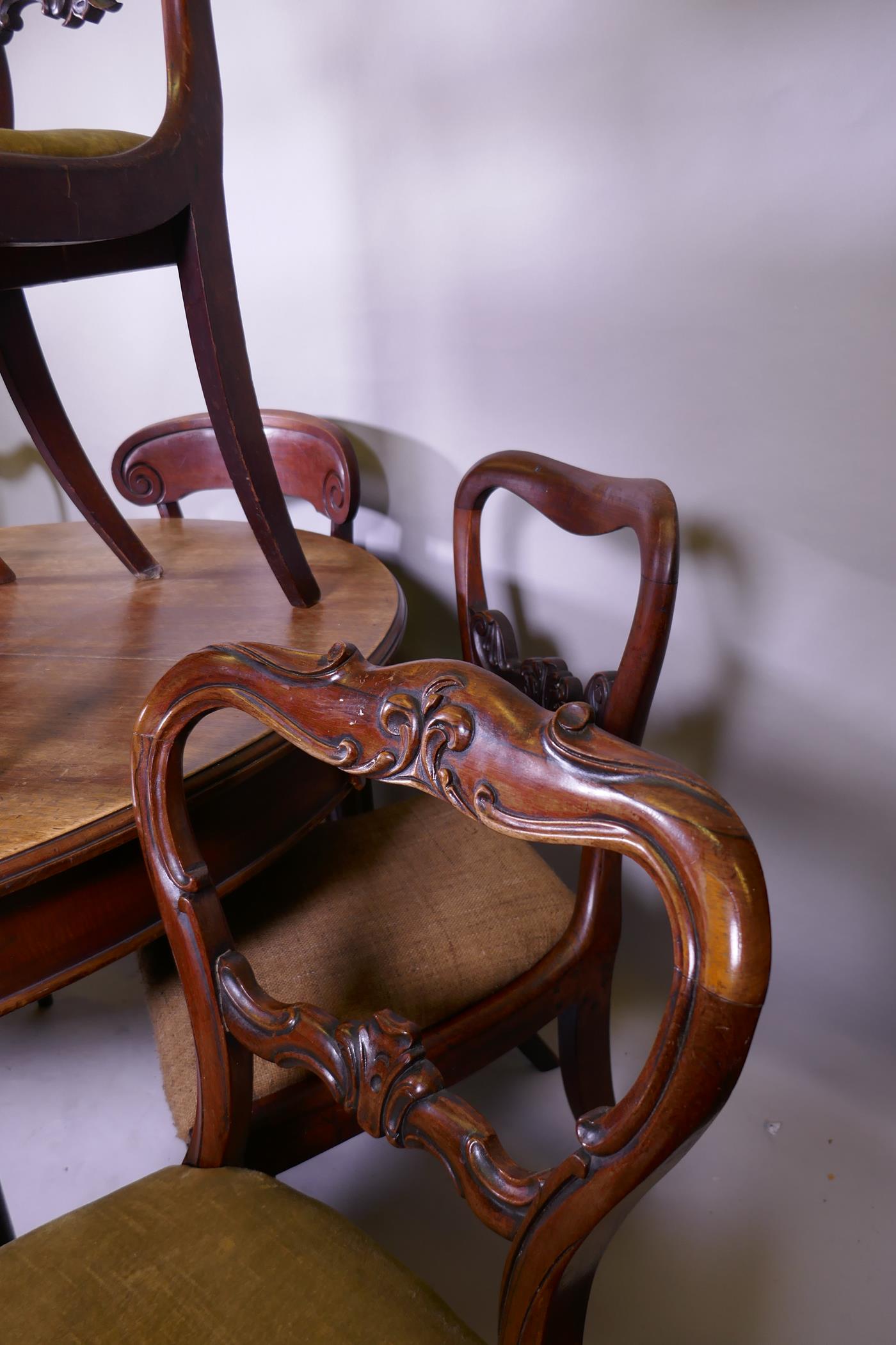 A mahogany wind out dining table, raised on turned supports with pad feet and a harlequin set of - Image 4 of 4