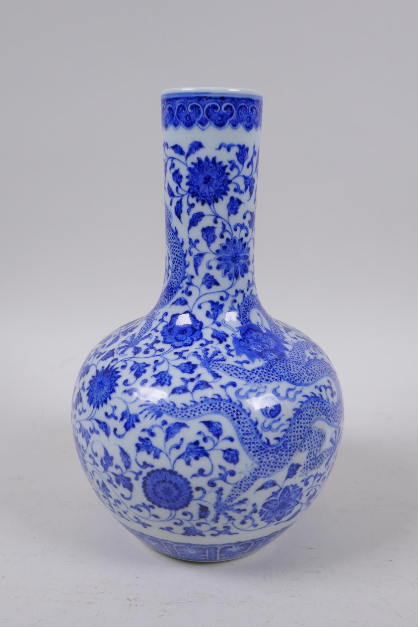 A Chinese blue and white porcelain bottle vase with dragon and lotus flower decoration, Qianlong - Image 4 of 5