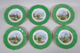 A set of twelve Staffordshire Paladin china plates decorated with green borders and continental