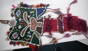 A woollen tribal wall hanging decorated with beads, shells and buttons, 197cm long, 53cm wide