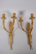 A pair of ormolu two branch wall sconces in the form of arrow quivers, 41cm