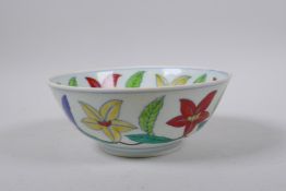 A polychrome porcelain bowl with scrolling floral decoration, Chinese Chenghua 6 character mark to