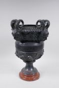 A bronze urn with four satyr mask handles, AF, 40cm