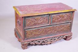 An antique painted hardwood chest of three drawers raised on a carved and pierced base, 85 x 44 x