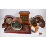 An oak cased mantel clock with brass dial and chiming movement, 29cm high, and two oak cased chiming