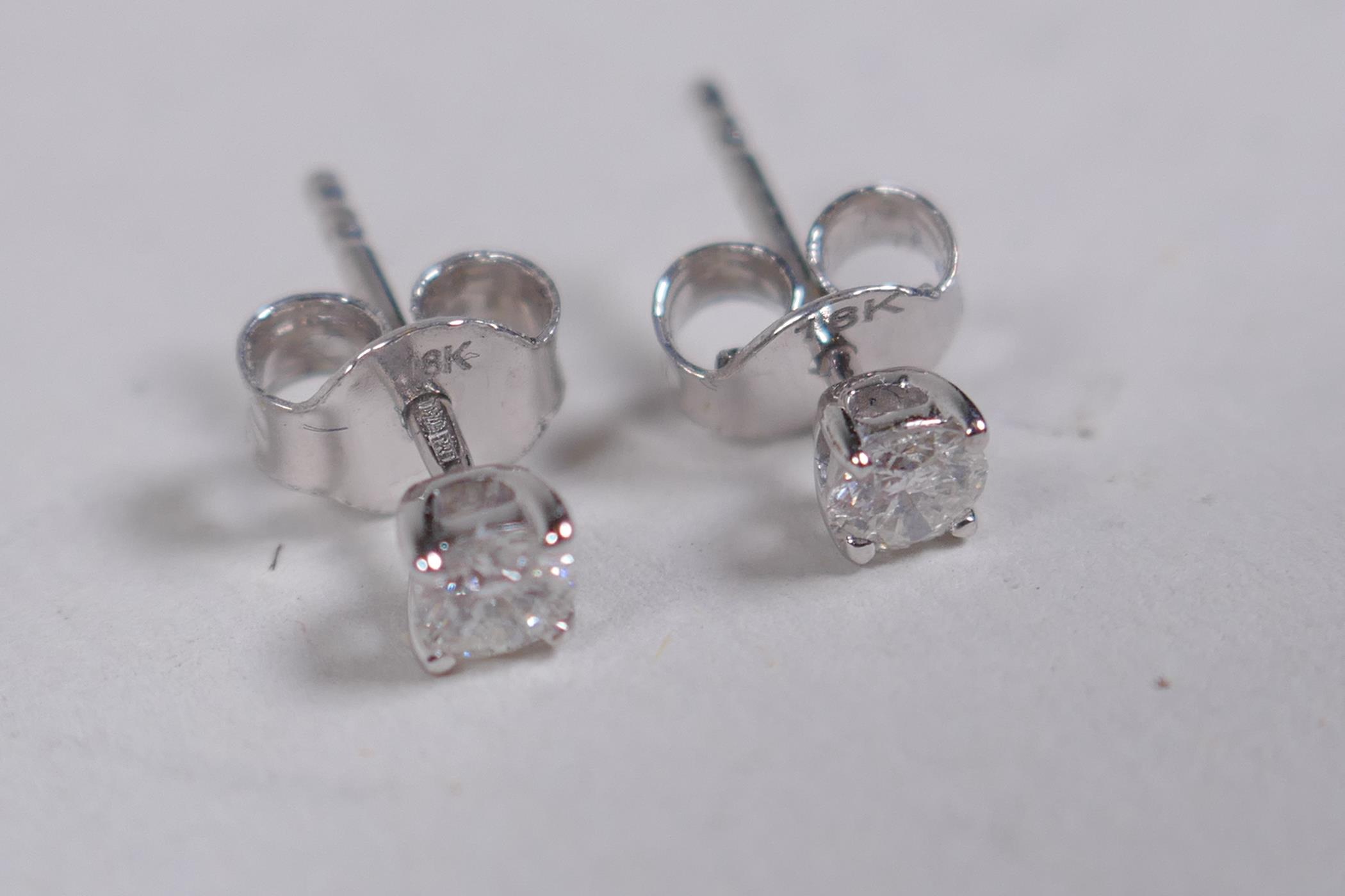 A pair of 18ct white gold stud earrings, approx 30 points - Image 2 of 2