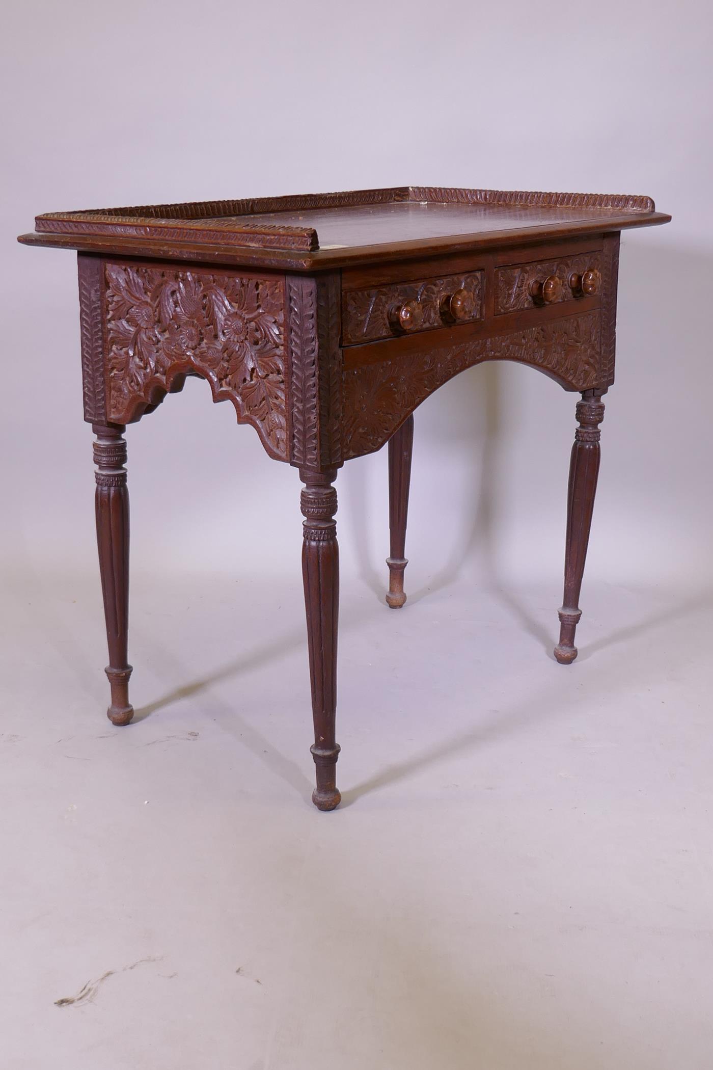 C19th Anglo Indian two drawer padouk writing table with three quarter gallery and carved floral - Image 3 of 4