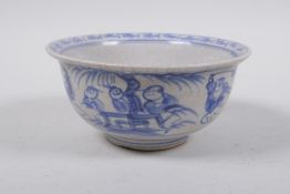 A Chinese blue and white porcelain rice bowl decorated with boys flying kites, 14cm diameter