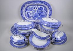 A Wedgwood Seville pattern part dinner service comprising four oval serving platters, largest 40 x