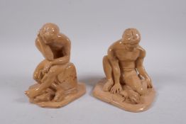 A pair of natural glazed pottery figures of male nudes, monogramed to base, 15cm high