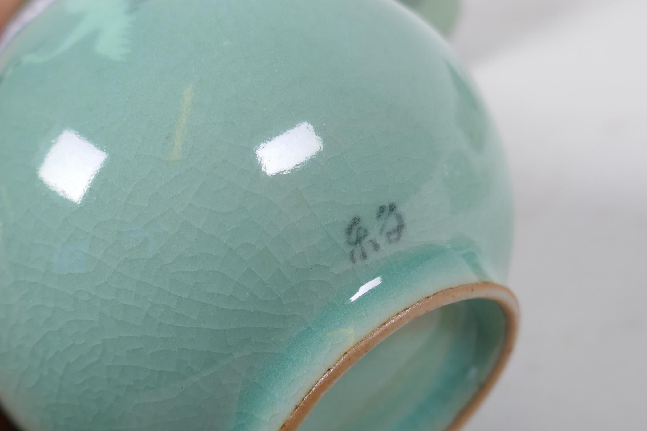 Oriental celadon glazed wine bottle and four cups, decorated with flying birds, 17cm high - Image 3 of 4