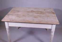 A Victorian pine scullery table with scrubbed top and painted base, raised on turned supports, 122 x