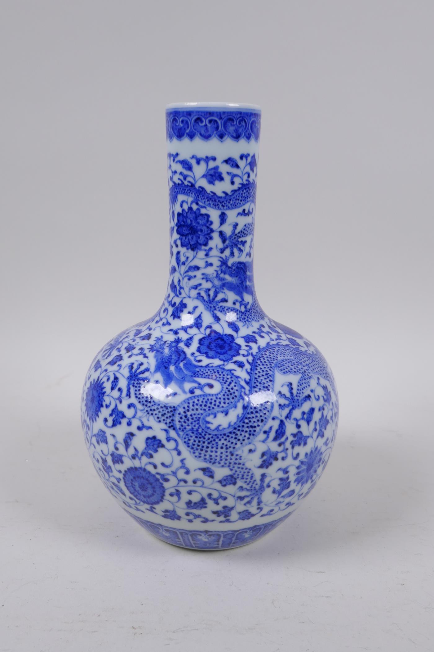 A Chinese blue and white porcelain bottle vase with dragon and lotus flower decoration, Qianlong - Image 2 of 5