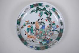 A famille vert porcelain charger decorated with women and deer in a landscape, Chinese Kangxi 6