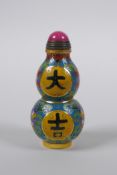 A Chinese cloisonne double gourd snuff bottle with decorative character panels and lotus flowers,