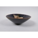 A Chinses Cizhou kiln conical bowl with kylin decoration, 15cm diameter