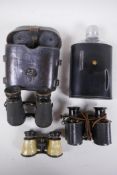 A pair of early C19th Goerz Pozsony binoculars in a leather case, another pair of early binoculars