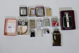 A Ronson Mastercase cigarette lighter in original box, another, a Photo Flash table lighter in