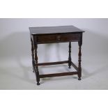 A William and Mary oak single drawer side table on turned supports, united by stretchers,