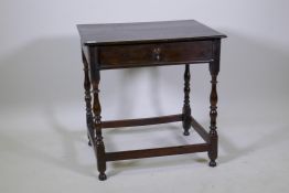 A William and Mary oak single drawer side table on turned supports, united by stretchers,