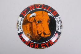 A vintage style enamel 'Dr Bull's Cough Syrup' sign, 30cm diameter