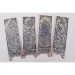 A set of four Chinese white metal scroll weights in the form of screen panels with raised