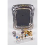 A silver plated photo frame, 34 x 28cm overall, a pair of mother of pearl and brass opera glasses,