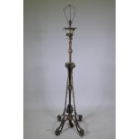 A C19th adjustable brass lamp stand of organic leaf form in the manner of Benson, converted to