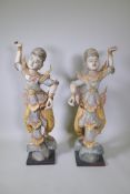 A pair of Indian carved and painted hardwood figures of dancers, 117cm high
