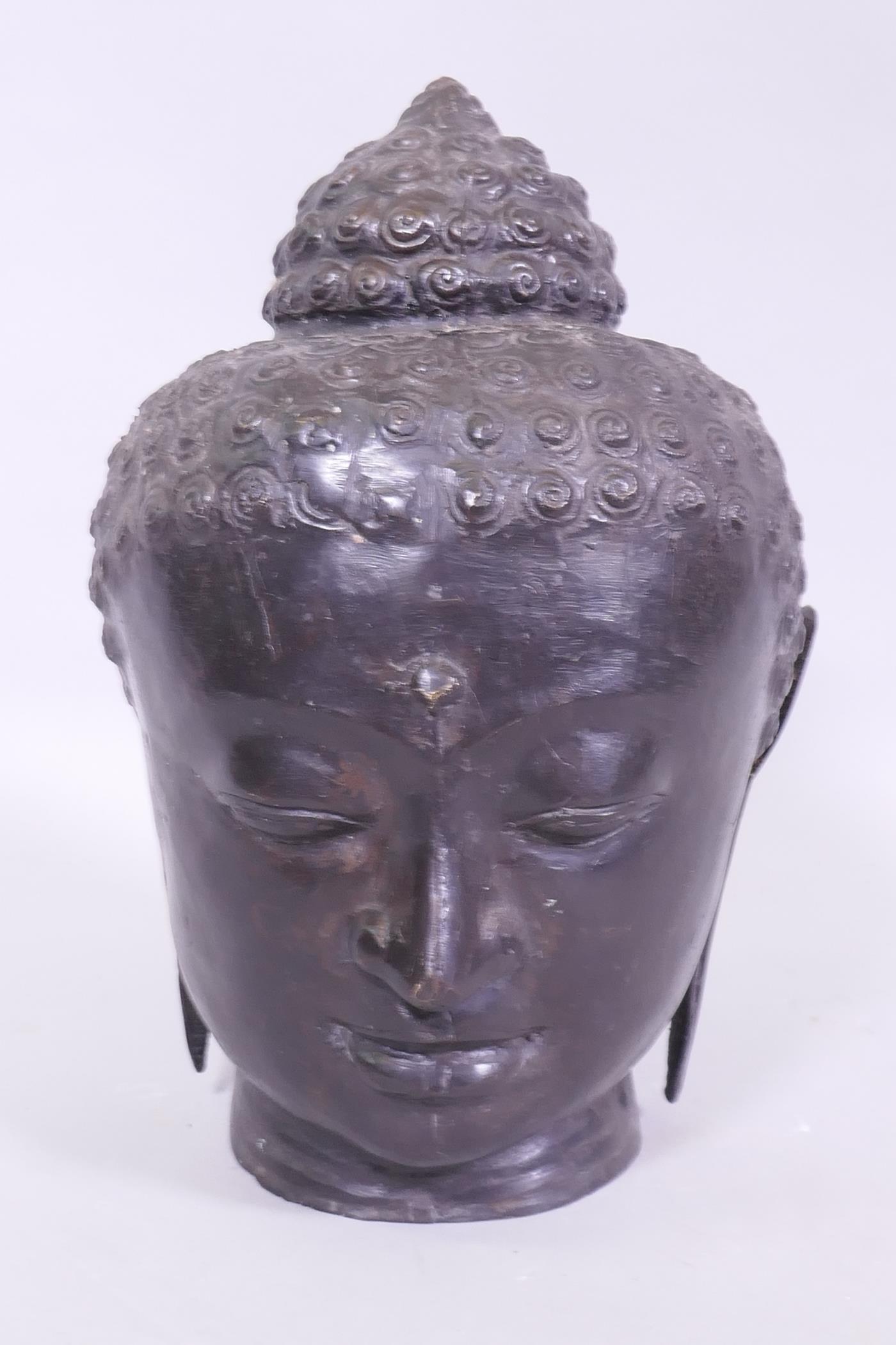 A hollow bronze Buddha's head, 30cm high - Image 2 of 5