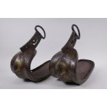 A pair of Japanese Edo period Shitanaga Abumi Samurai stirrups in cast iron with multi metal