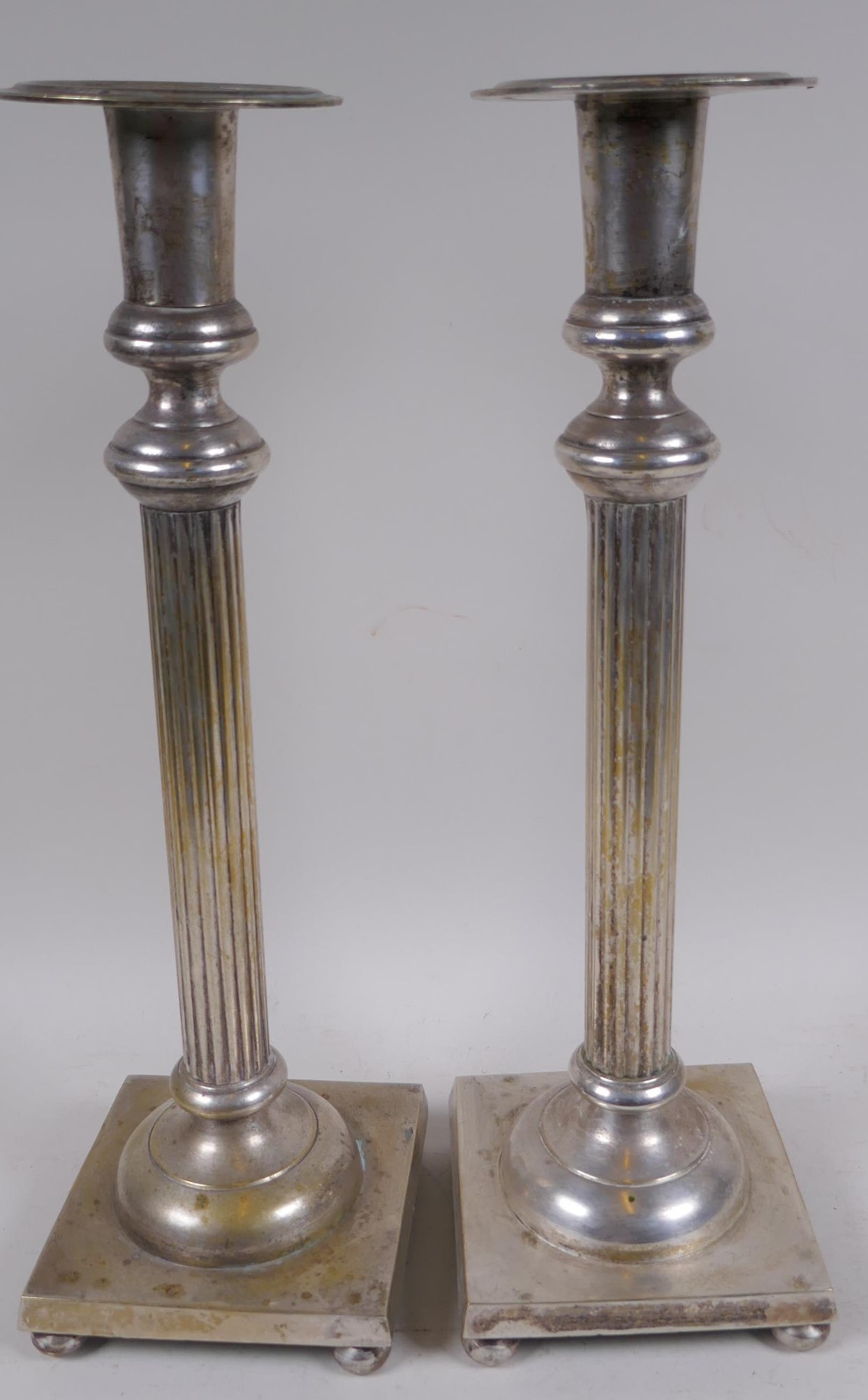A pair of Victorian silver plated column candlesticks, 40.5cm high