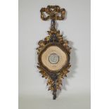 A continental carved and gilt wood cased barometer, with ribbon crest and leaf and flower