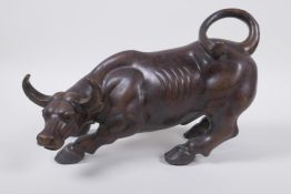 A Chinese filled bronze buffalo, 26cm long