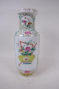 A Chinese rouleau shaped porcelain vase painted with urns and flowers in bright enamels, drilled,