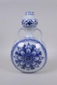 A Chinese blue and white porcelain two handled moon flask with Yin Yang decoration, Xuande 6