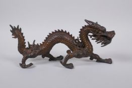 A Chinese gilt bronze dragon, 25cm long