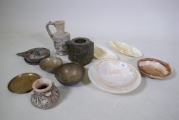 A collection of Middle Eastern alabaster bowls, bronze bowls, carved stone, soapstone etc, glass