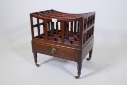 A Georgian mahogany canterbury with single drawer, ring turned supports and brass castors, 45 x