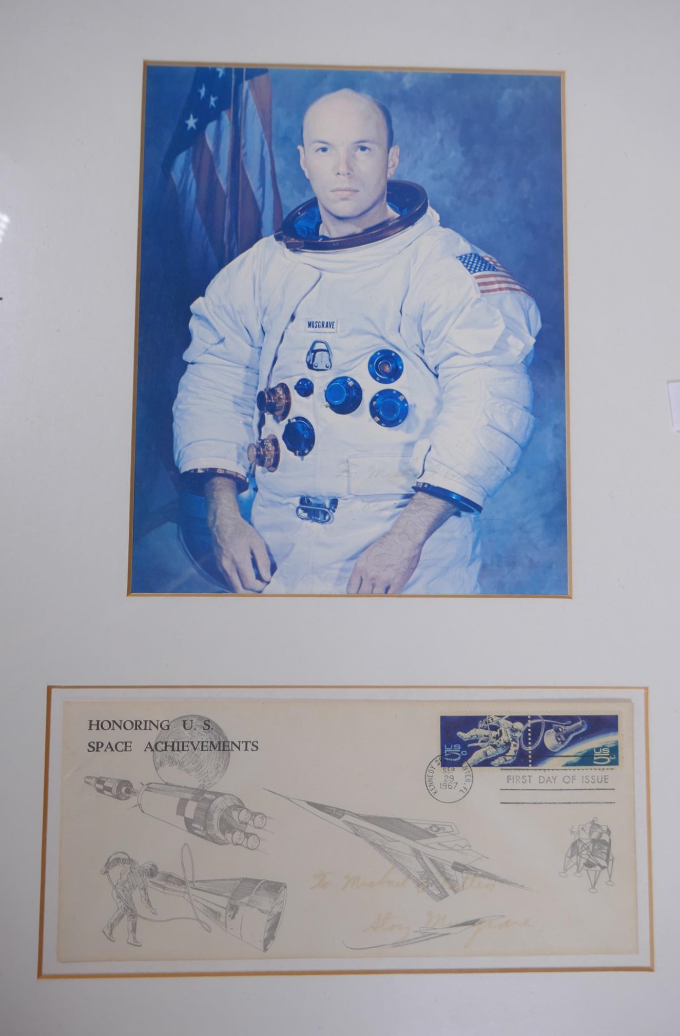 A signed photograph of the astronaut F. Storey Musgrave, and a 1967 Commemorative First Day cover