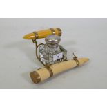 A Victorian inkwell with brass mounted faux ivory tusks, 24 x 12cm